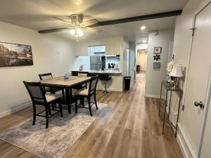 a dining room and kitchen with a table and chairs at NEW Modern Retreat in Richardson