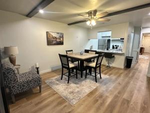 a dining room and living room with a table and chairs at NEW Modern Retreat in Richardson +21 photos
