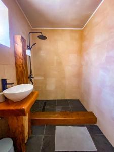 a bathroom with a sink and a shower at Vientos - La Yareta in San Pedro de Atacama +47 photos