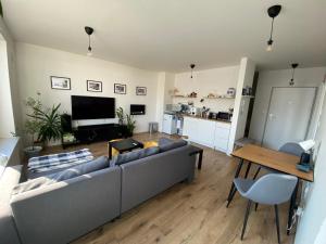 a living room with a couch and a table at Apartment Nina in Hrubá Borša