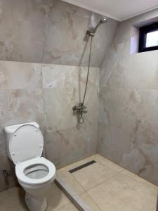 a bathroom with a toilet and a shower at Sno loveland in Sno +9 photos