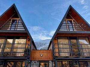 a house with large windows and mountains in the background at Sno loveland in Sno
