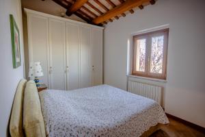 Llit o llits en una habitació de IMMERSA NEL VERDE