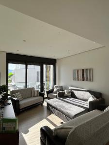 a large living room with couches and a couch at Ayla Oasis Luxury Chalets - Azure & Golf in Aqaba +61 photos