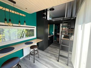 a kitchen with a table and two chairs in a room at Le repère d Howardries in Brunehaut +17 photos