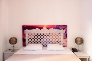 Postel nebo postele na pokoji v ubytování Atlas Boutique Hotel