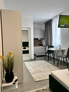a living room with a couch and a dining room at EriSSSo House Murfatlar in Murfatlar