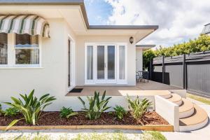 a rendering of a house with a fence at Kaimana in Gold Coast
