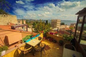 a balcony with a table and chairs on a building at Esans Hotel - Special Category in Istanbul