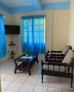 a living room with a couch and a coffee table at Duncan Apartment #1 in Port Elizabeth