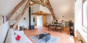 a living room with a couch and a table at Water Mill - Private Lake - Fiber Wifi - Burgundy in Rix