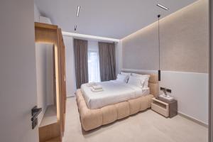 a hotel room with a bed and a window at SOLUNA Hideaway Athens - Luxury Jacuzzi Suite in Athens