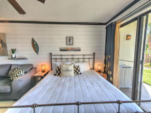 a bedroom with a bed and a couch at Pirates Bay B114 in Fort Walton Beach +54 photos