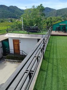 a roof of a building with a table and benches at Loft 101 in Rio de Janeiro