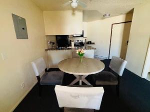 a room with a table and chairs and a kitchen at 1Bd Prime Westwood Location One Block from UCLA in Los Angeles