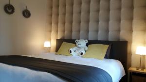 Ein Bett oder Betten in einem Zimmer der Unterkunft Le Chalet de Marguerite