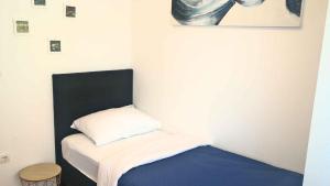 a small room with a bed and a pillow at Apartment in Cavle 54436 in Čavle