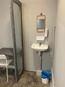 a bathroom with a sink and a mirror at Roomah Ipoh En-suite attached-Bath R2 in Ipoh