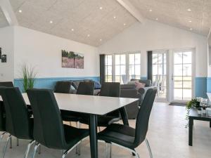 a dining room with a table and chairs at 8 person holiday home in Læsø in Læsø