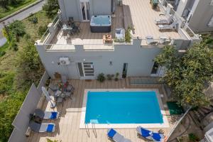 an overhead view of a house with a swimming pool at Vista Magica in Chania