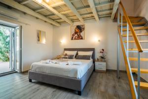 a bedroom with a bed and a staircase at Vista Magica in Chania +47 photos