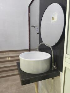 a bathroom with a sink and a mirror at Casa Ariana Machang 3B3R in Macang