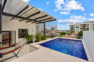 a swimming pool on the balcony of a building at Unit Aguacates Romantic Zone in Puerto Vallarta