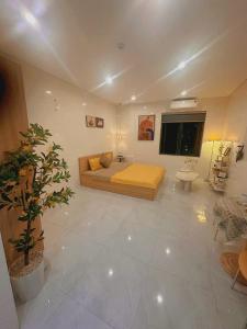 a large room with a bed and a television in it at Top apartment in Hà Tĩnh +15 photos