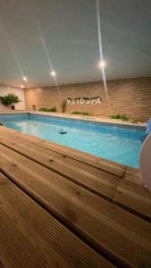a large swimming pool in a building at Vitospa in Cauffry