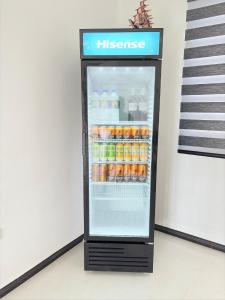 a refrigerator full of drinks in a store at Danketiya Palace in Ahangama