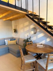 a living room with a couch and a table at מים במדבר in Zuqim