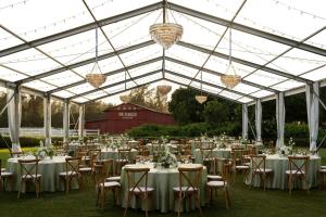 a marquee set up for a wedding with tables and chairs at The Ritz-Carlton O'ahu, Turtle Bay in Kahuku +178 photos