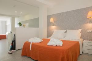 Postel nebo postele na pokoji v ubytování Apartamentos Turísticos Mix BR AT2179