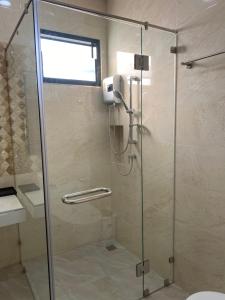 a shower with a glass door in a bathroom at Cozy Palm Hills in Ban Nong Thale +29 photos
