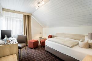 Ένα ή περισσότερα κρεβάτια σε δωμάτιο στο Business Class Hotel Häckermühle