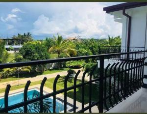 a balcony with a view of a swimming pool at Bellamoon Resort in Trincomalee +16 photos