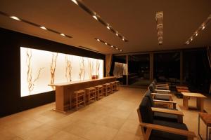 a restaurant with chairs and a bar in a room at AUBERGE de SENVIE in Sakurai
