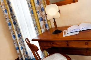 Postel nebo postele na pokoji v ubytování Hotel Beau Site