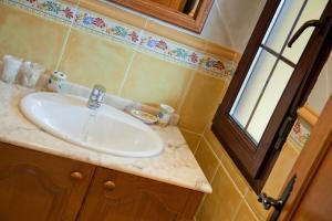 a bathroom with a sink and a window at Las Anjanas de Isla in Isla +45 photos