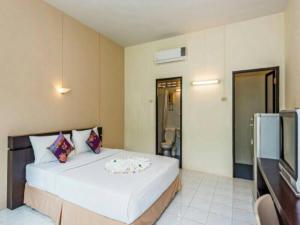 Postel nebo postele na pokoji v ubytování Baantonsai Garden Resort + 16 fotografií