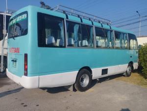 a blue and white bus parked in a parking lot at Sedan cab car four wheel jeep in Pokhara