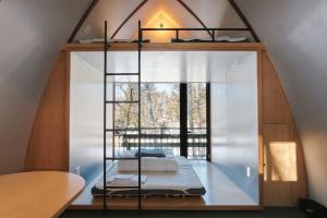 a room with a bed in a room with a window at Tiny Garden Tateshina in Chino +32 photos