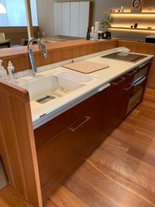 a kitchen with a sink and a counter at Maru Izumiyacho in Kyoto +42 photos