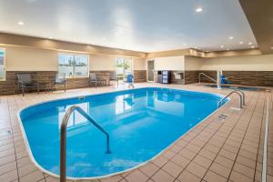 a large pool with blue water in a hotel room at Fairfield Inn by Marriott Richmond in New Paris