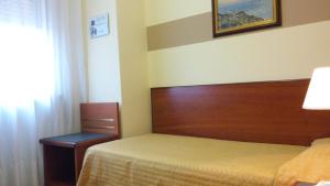 Ein Bett oder Betten in einem Zimmer der Unterkunft Hotel Due Fontane