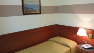 Ein Bett oder Betten in einem Zimmer der Unterkunft Hotel Due Fontane