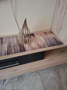 a close up of a wooden shelf in a room at Szabó Vendégház in Bükkszék