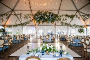 a wedding reception in a tent with tables and chairs at Coronado Island Marriott Resort & Spa in San Diego +108 photos