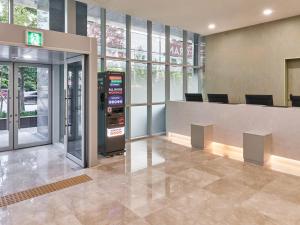 an atm machine in the lobby of a building at 센텀 뉴시즈 호텔 in Millak-tong