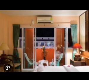 a room with a living room with a bed and a living room at Aonang Cozy VIP in Ao Nang 